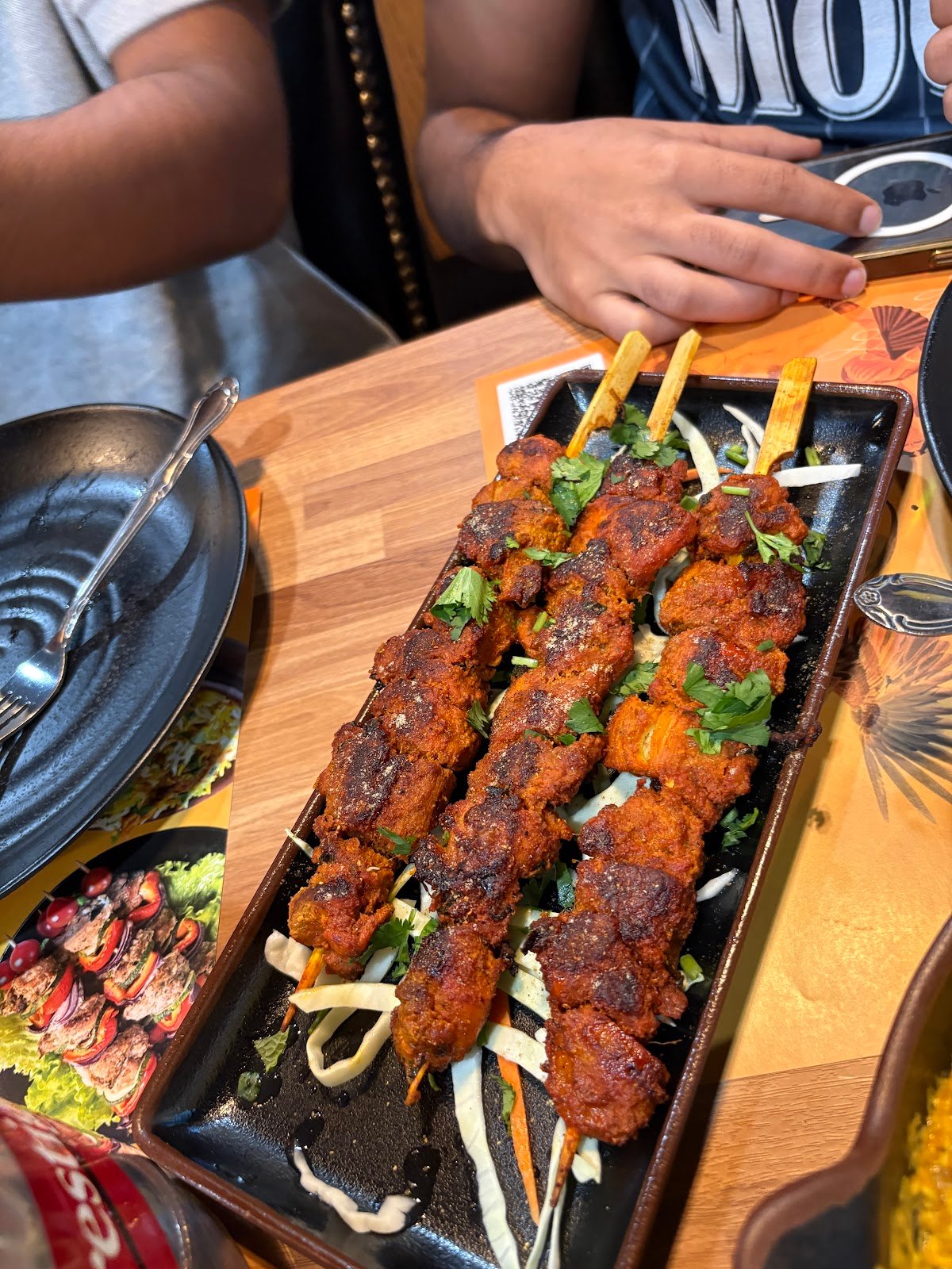 Kebabs grilling over open flame at HBK Frisco